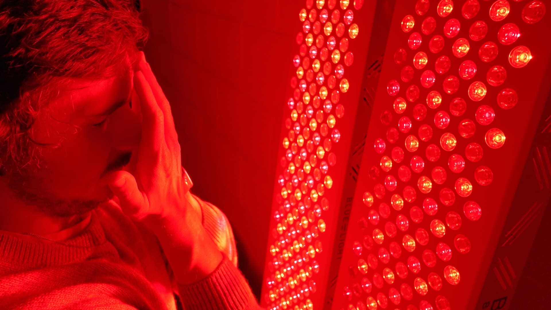 Intense photonic power and glare from dual red light panels