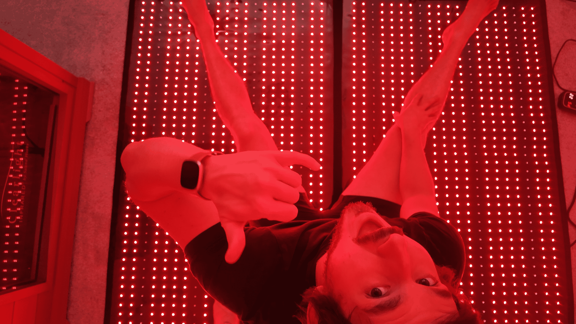 Stretching and doing yoga directly on top of the red light therapy blanket on the floor