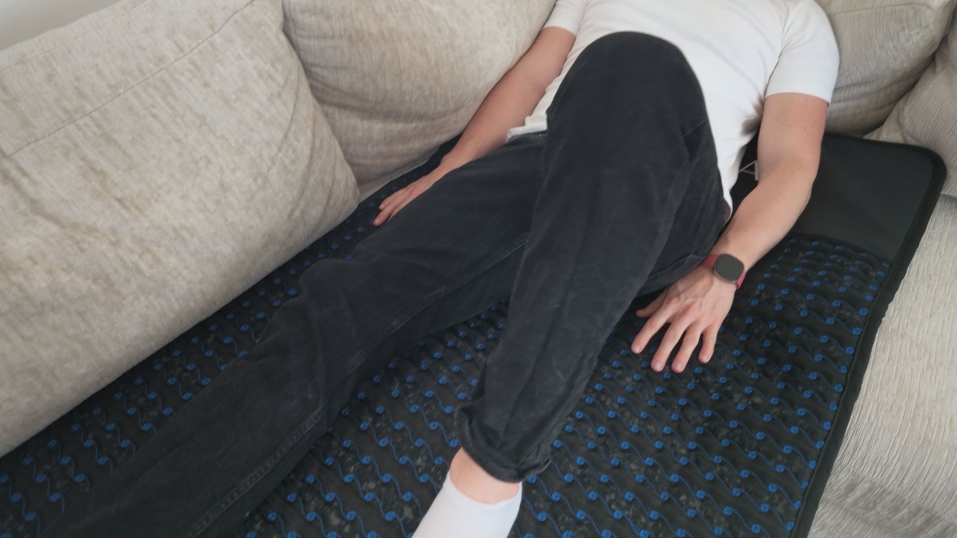 Relaxing on the sofa on top of the full body heated PEMF mat