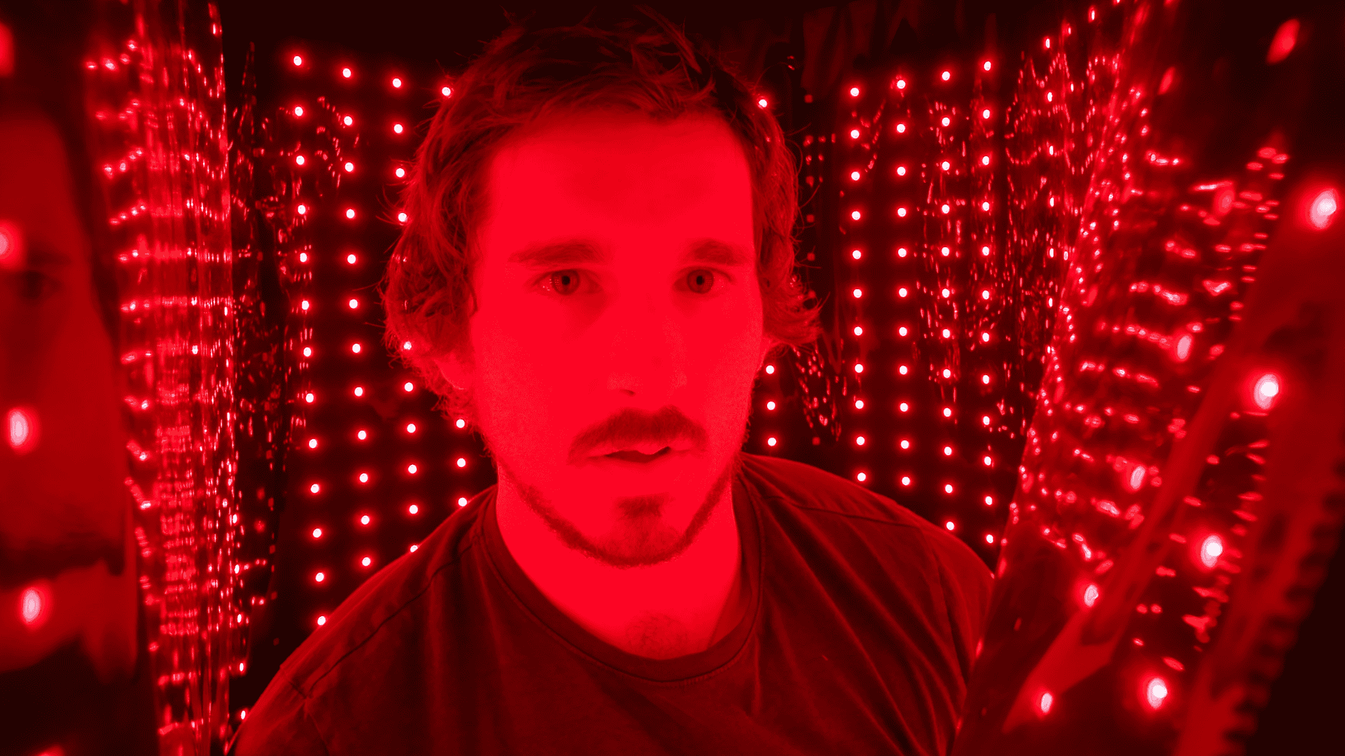 Garage Biohacker testing the physical fit and interior constraints of the red light blanket