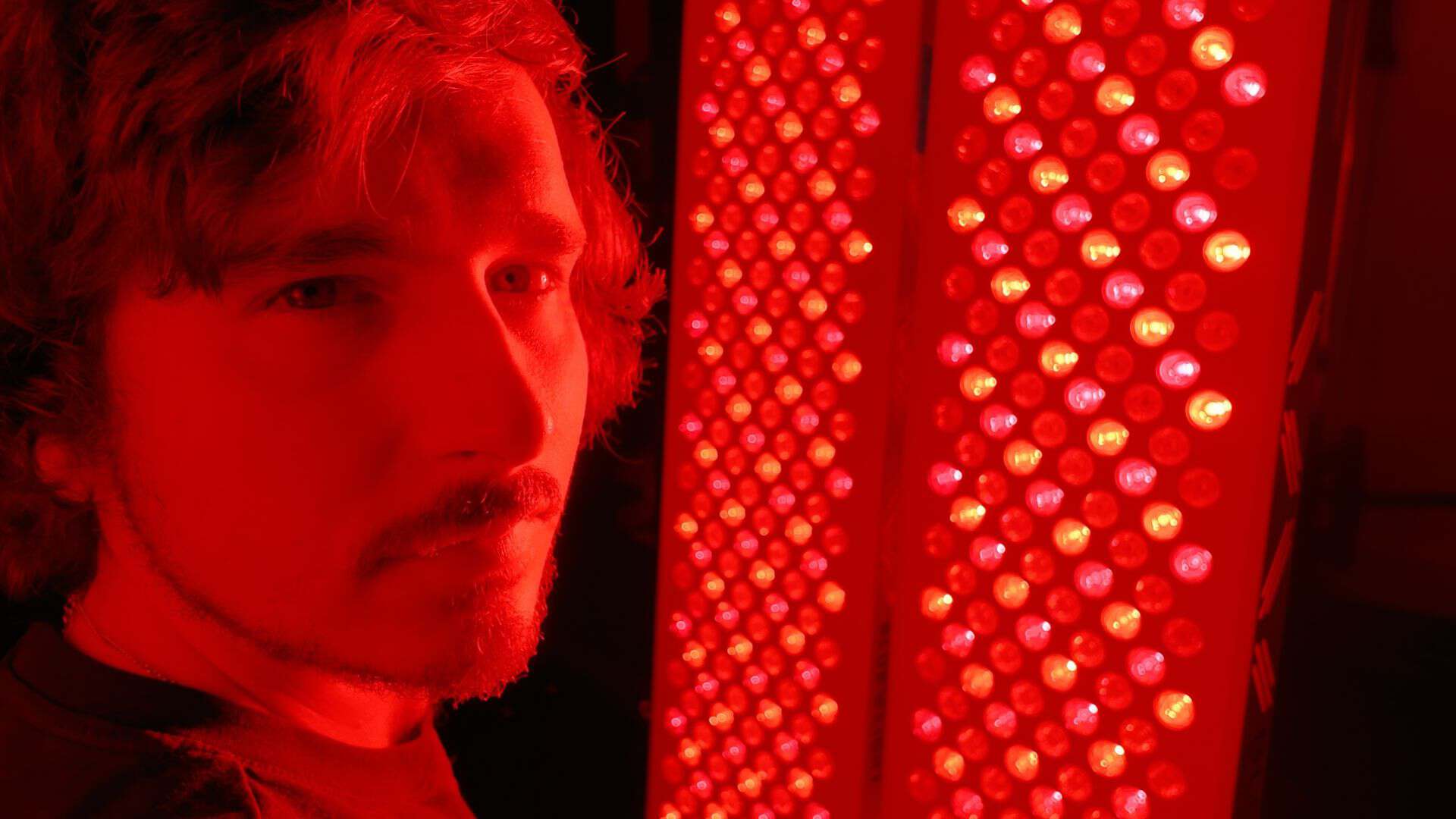 Intense red light bleeding into the room from high powered standalone therapy panels