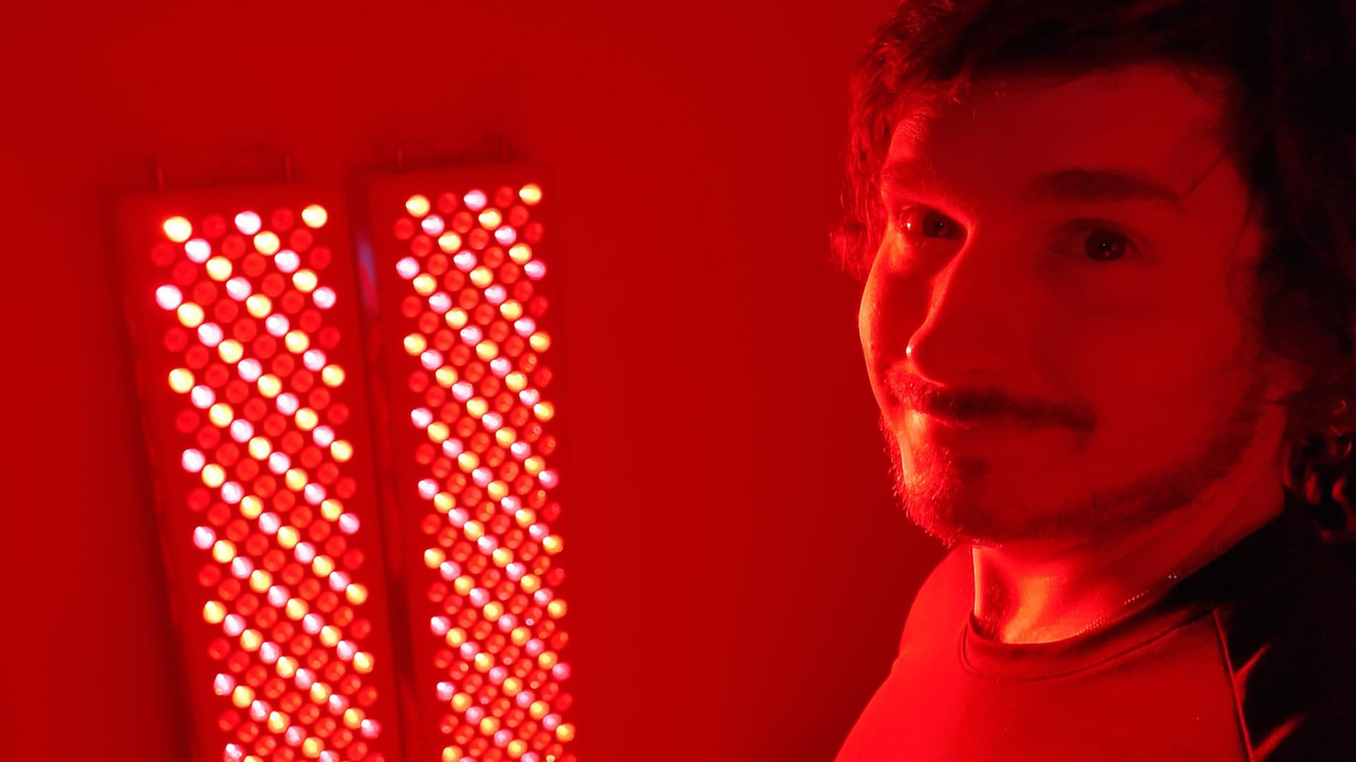 Garage Biohacker in front of dual BlockBlueLight panels logging over 620 sessions
