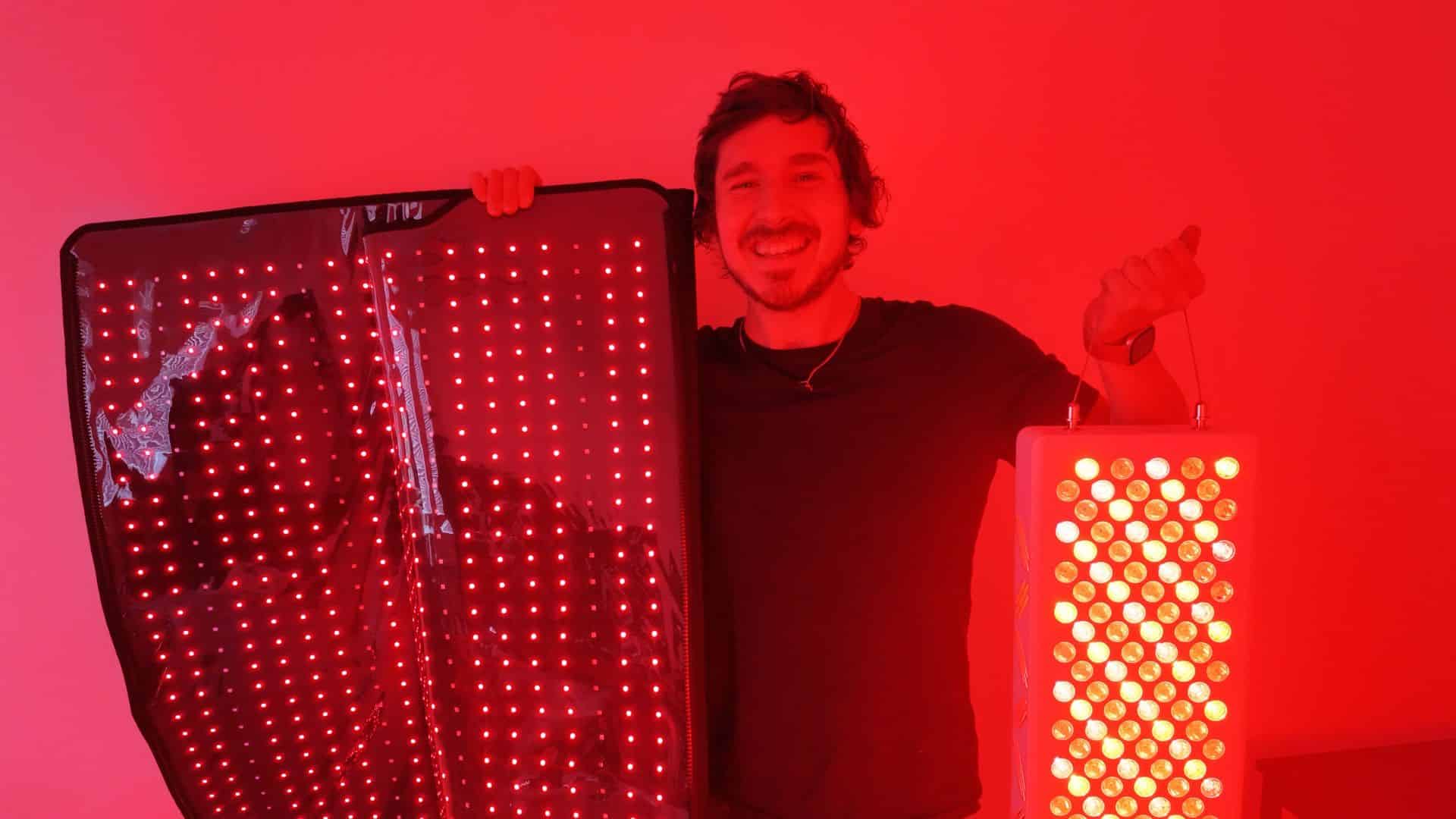 Holding red light therapy blanket and compact red light panel side by side