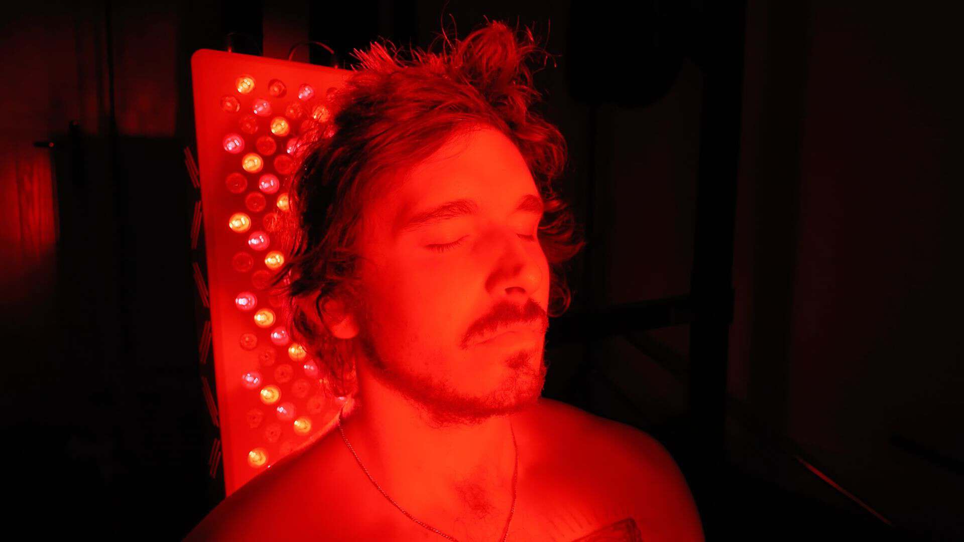Daily red light scalp session positioned 6 to 8 inches in front of high output panel