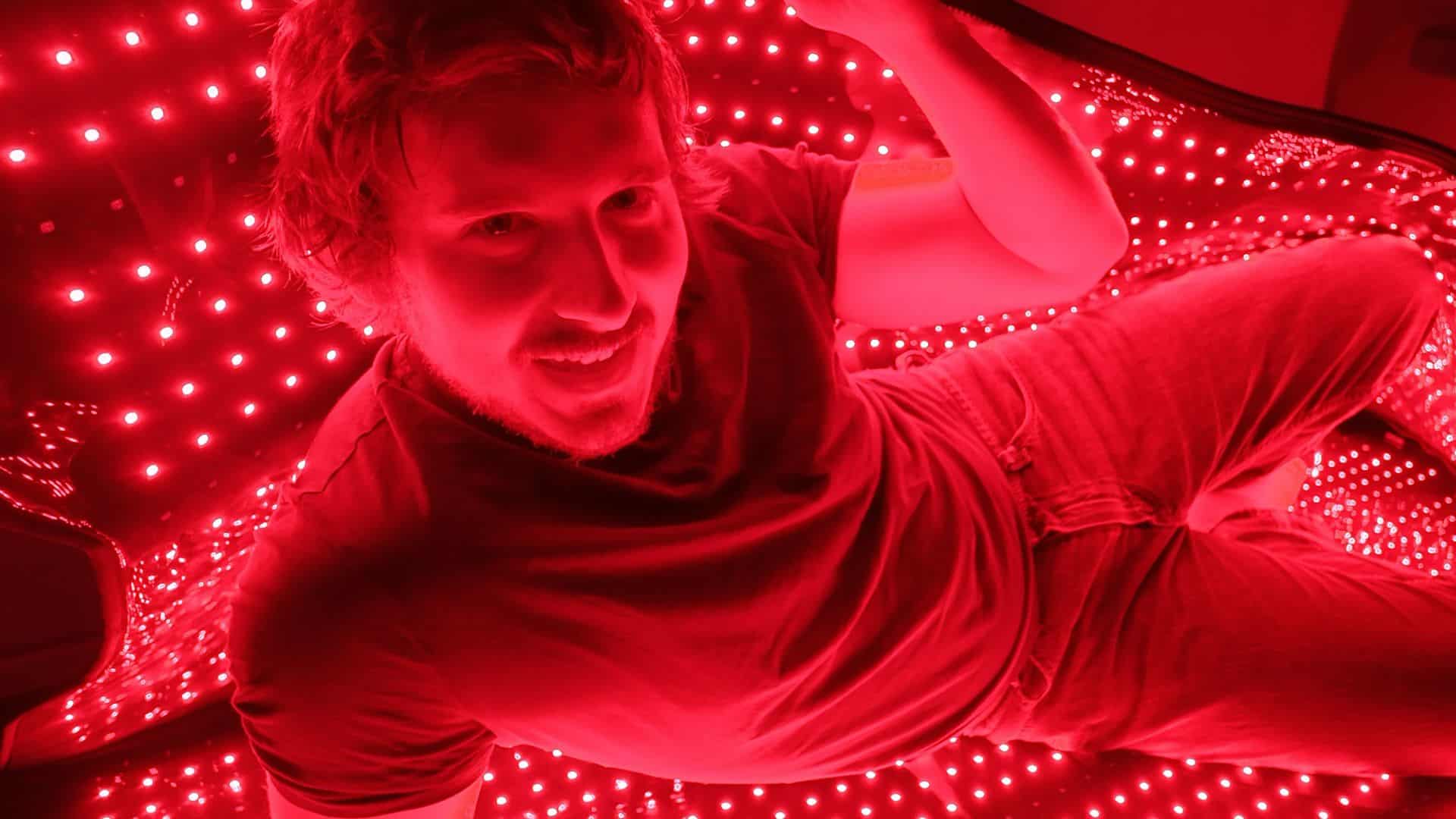 Relaxing inside red light therapy blanket on the floor for whole body recovery