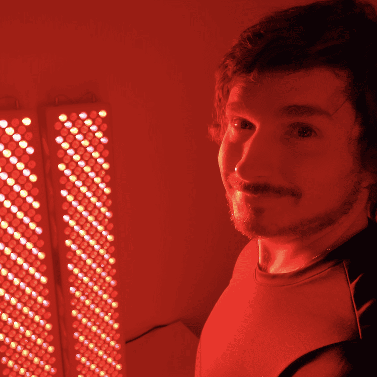 smiling with red light working in the background